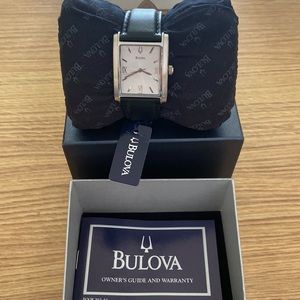 Brand new Bulova watch with black leather strap.